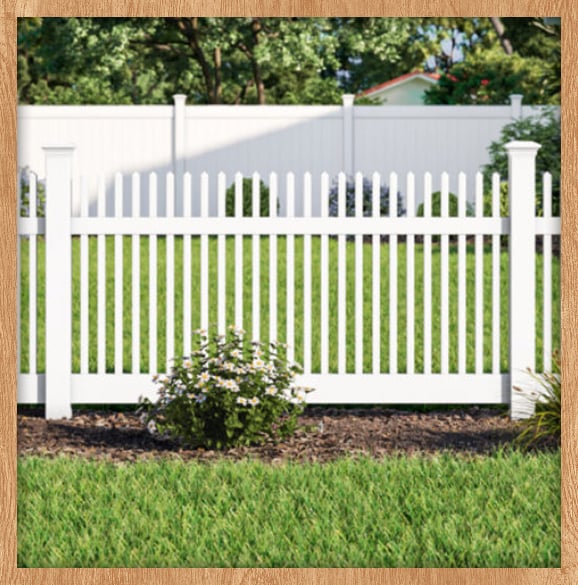 Fenced suburban property with houses and trees.