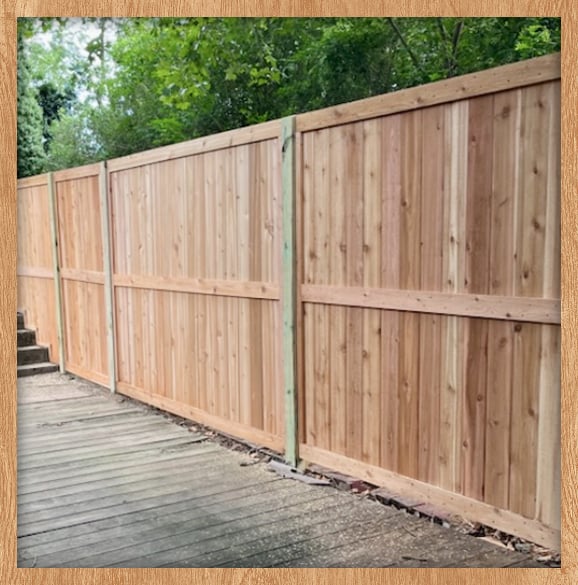 Completed fence installation on a residential lot.