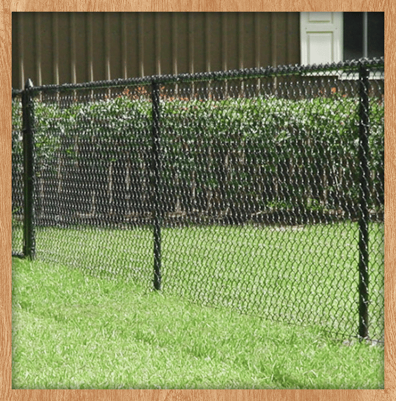Finished fencing project along a backyard.