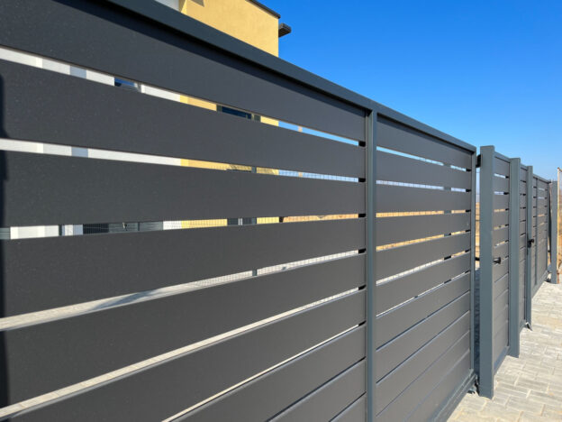 Horizontal fencing installed near a building.